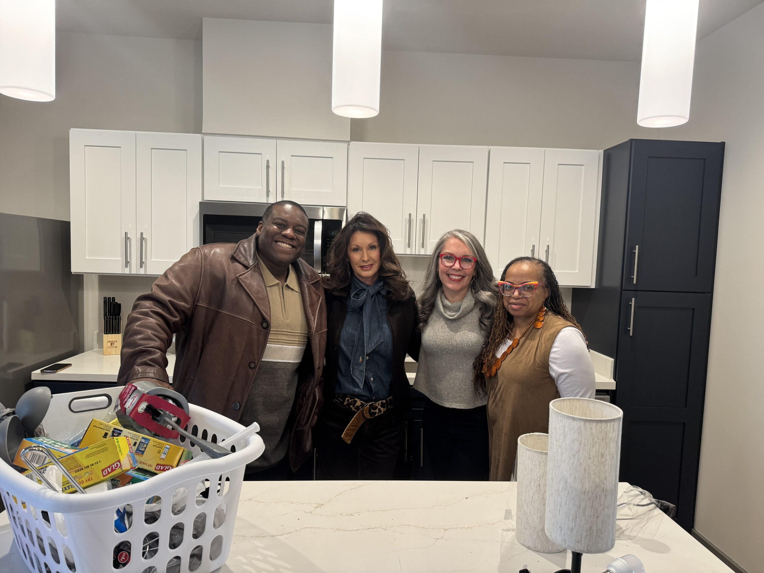 Featured image for “Local organizations and volunteers stock KCDC’s Liberty Place units with household goods”